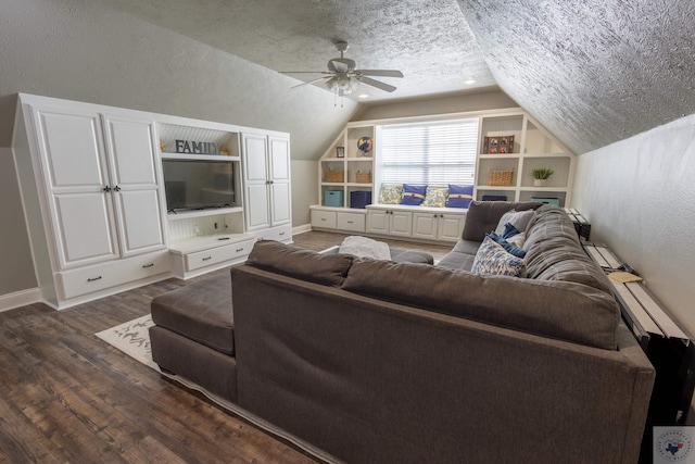 living room with ceiling fan, built in shelves, a textured ceiling, dark hardwood / wood-style floors, and lofted ceiling