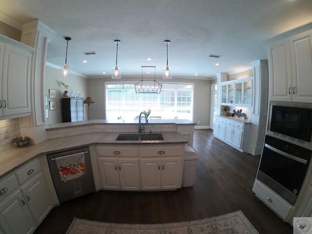 kitchen with stainless steel dishwasher, white cabinetry, and oven