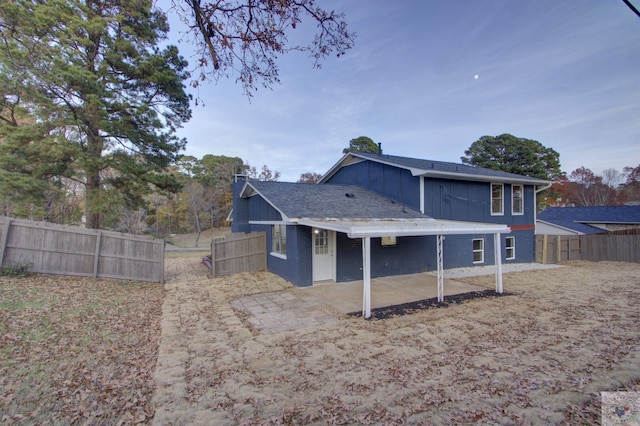 rear view of house with a patio