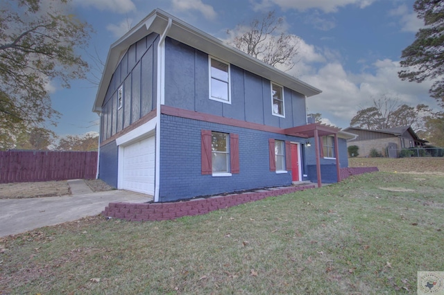 exterior space featuring a garage and a lawn