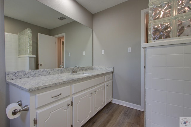 bathroom featuring vanity and wood-type flooring