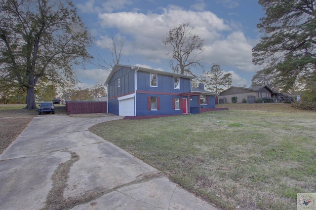 view of side of home featuring a garage and a yard