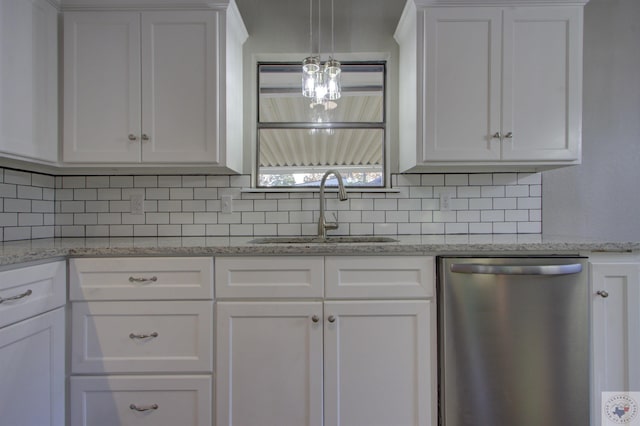 kitchen featuring stainless steel dishwasher and white cabinets