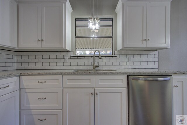 kitchen featuring stainless steel dishwasher and white cabinets