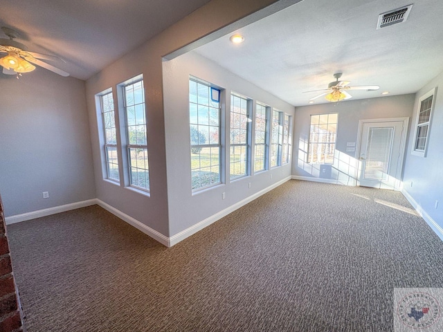 interior space featuring a textured ceiling and ceiling fan