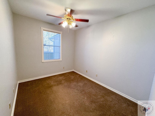 unfurnished room with ceiling fan and dark carpet