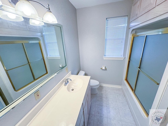 full bathroom featuring vanity, toilet, and combined bath / shower with glass door