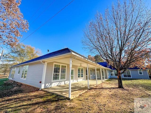 rear view of property featuring a patio area