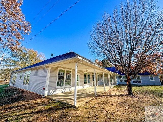 rear view of property featuring a patio area