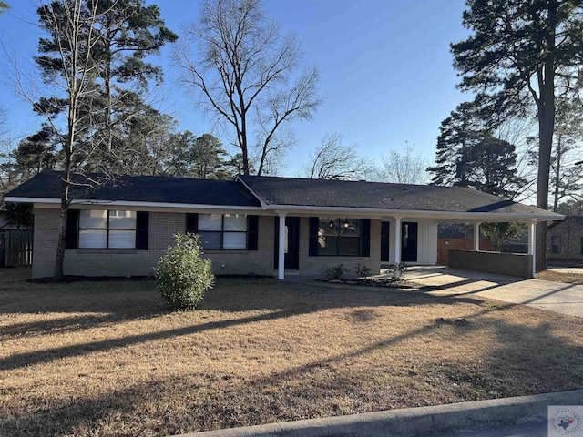 single story home featuring a carport and a front lawn