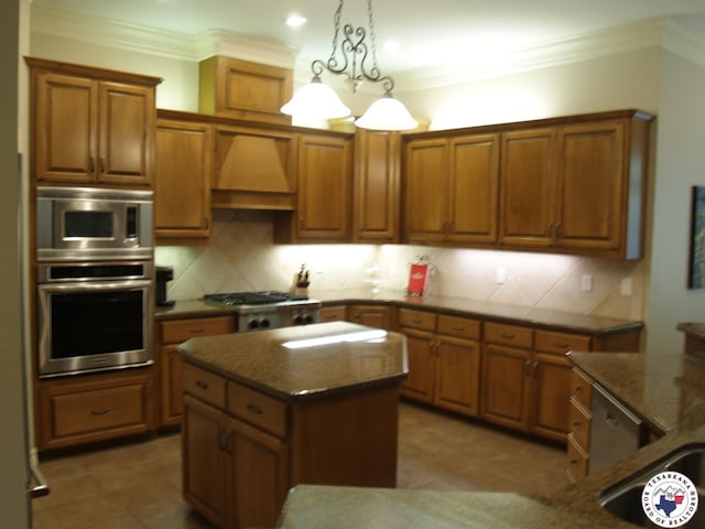 7 River Plantation, Texarkana, TX 75503 - kitchen featuring appliances with stainless steel finishes, a kitchen island, brown cabinetry, custom exhaust hood, and crown molding