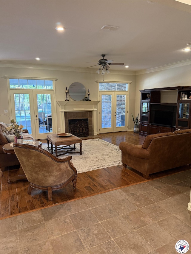 7 River Plantation, Texarkana, TX 75503 - living area featuring crown molding, french doors, ceiling fan, recessed lighting, and a tiled fireplace