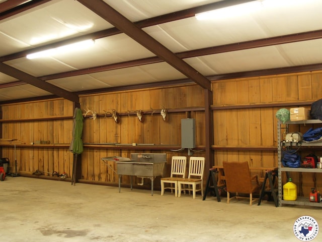 7 River Plantation, Texarkana, TX 75503 - garage featuring wooden walls and electric panel