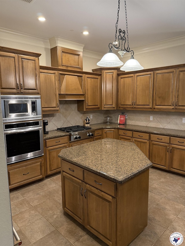 7 River Plantation, Texarkana, TX 75503 - kitchen with stainless steel appliances, custom range hood, a center island, crown molding, and brown cabinets