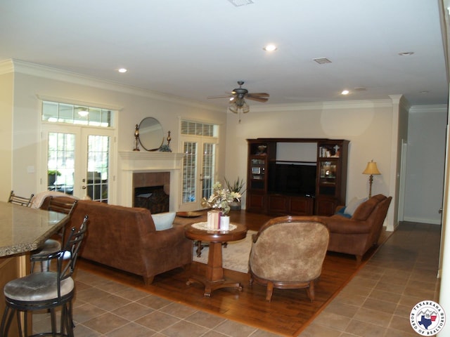 7 River Plantation, Texarkana, TX 75503 - living room featuring french doors, ornamental molding, a ceiling fan, a tile fireplace, and recessed lighting