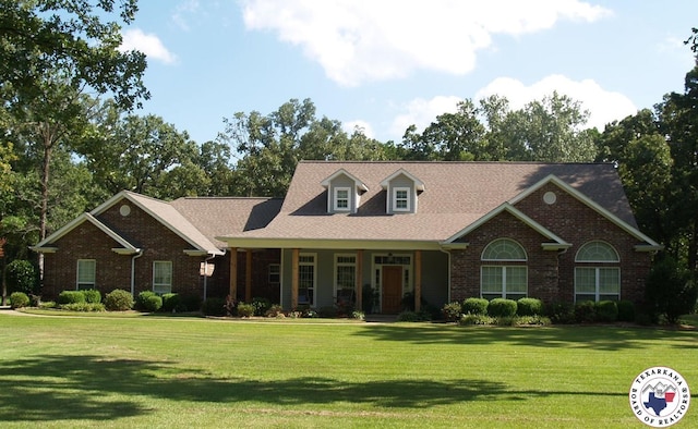 7 River Plantation, Texarkana, TX 75503 - view of front facade with a front yard, covered porch, and brick siding