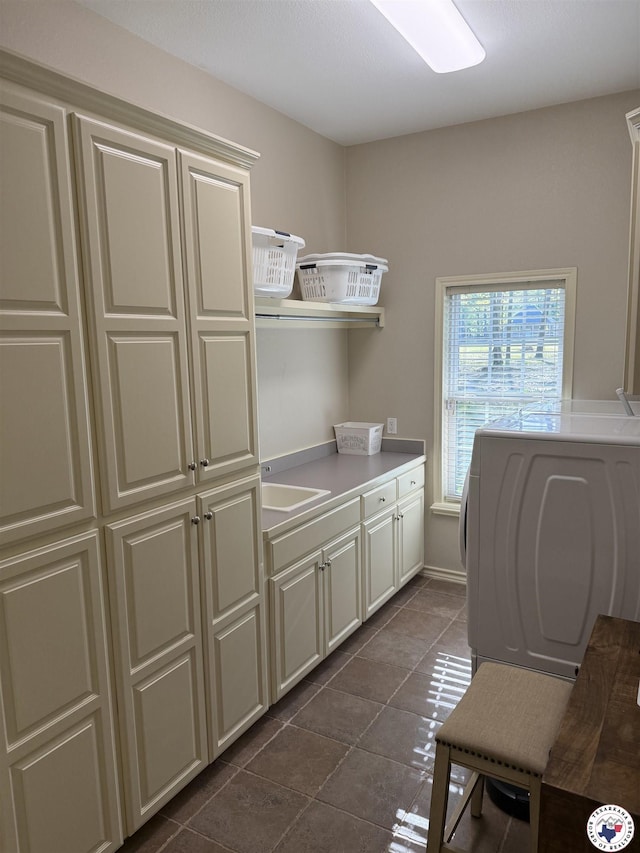 7 River Plantation, Texarkana, TX 75503 - laundry area featuring cabinet space, dark tile patterned flooring, and washer / dryer