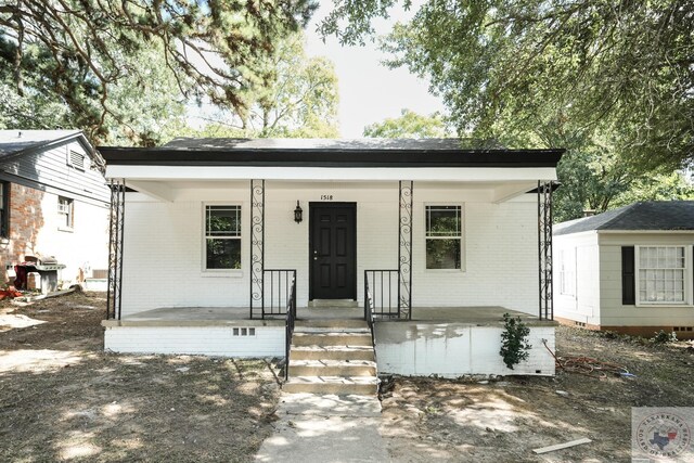 bungalow-style home with a porch