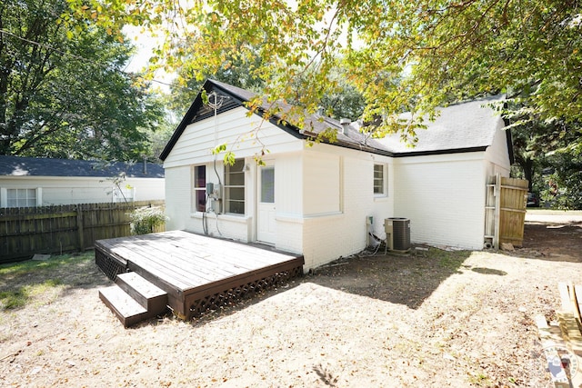 rear view of house featuring a deck and central air condition unit