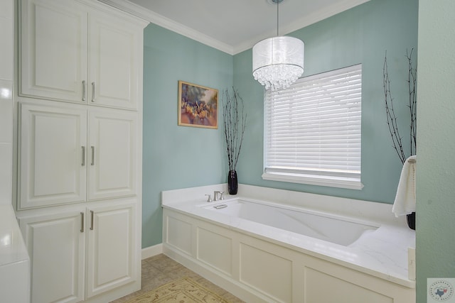 bathroom featuring a garden tub, a chandelier, and crown molding