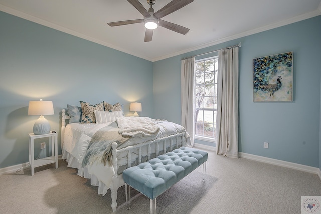 carpeted bedroom with baseboards, ornamental molding, and a ceiling fan