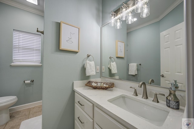 bathroom with tile patterned floors, toilet, vanity, and ornamental molding