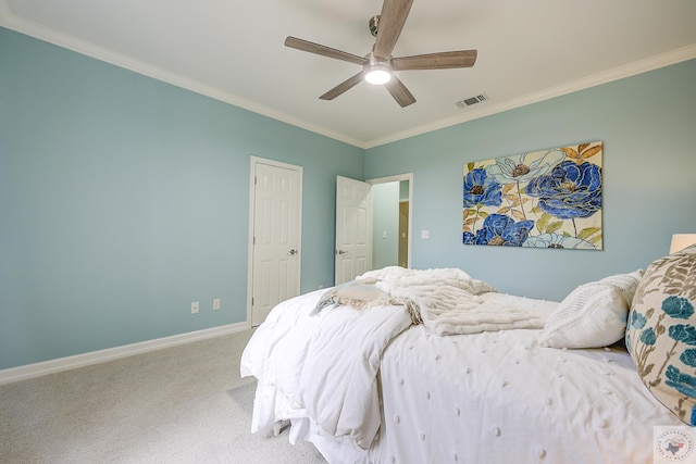 carpeted bedroom with a ceiling fan, baseboards, visible vents, and ornamental molding