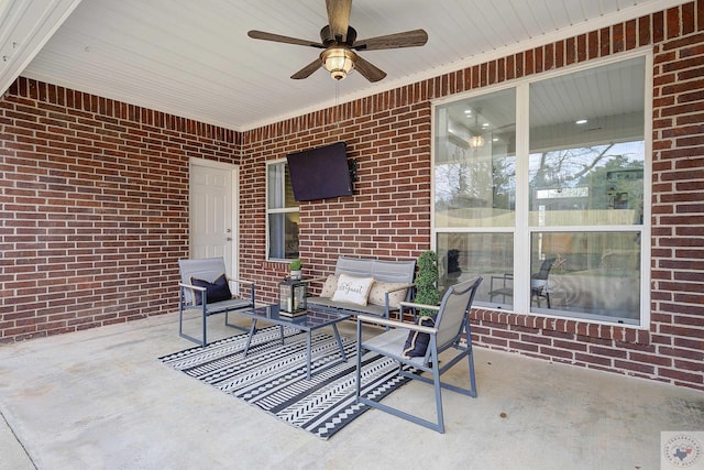 view of patio with an outdoor living space and a ceiling fan