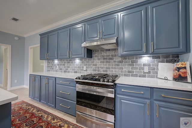 kitchen featuring under cabinet range hood, blue cabinets, gas range, and light tile patterned floors