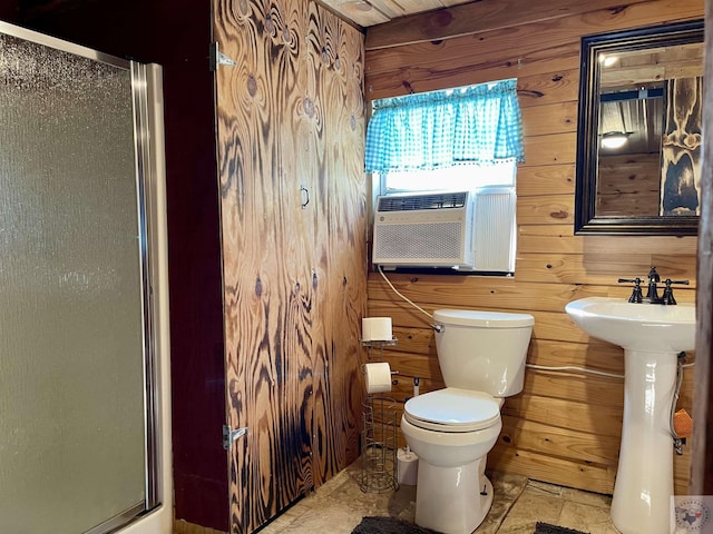 bathroom featuring cooling unit, an enclosed shower, wood walls, and toilet