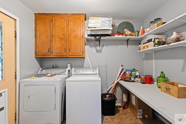 washroom with cabinets and independent washer and dryer