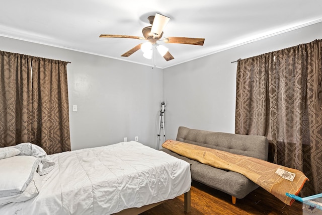 bedroom featuring crown molding, ceiling fan, and hardwood / wood-style flooring