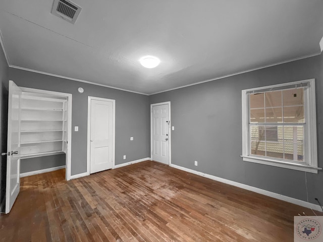 unfurnished bedroom featuring hardwood / wood-style flooring