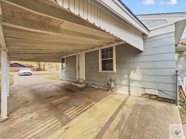 exterior space featuring a carport