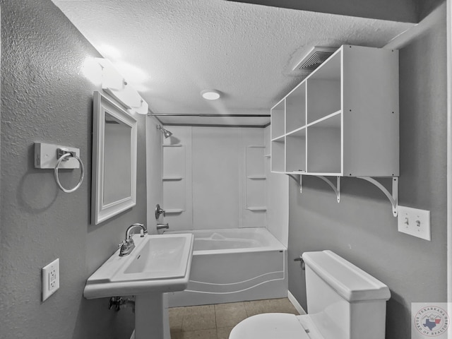 bathroom featuring shower / bathtub combination, a textured ceiling, and toilet