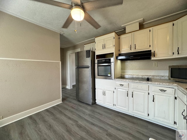 kitchen with ceiling fan, dark hardwood / wood-style flooring, white cabinetry, a textured ceiling, and stainless steel appliances