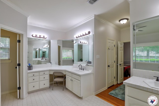 16 Bill Rogers Dr, Texarkana, TX 75503 - full bath featuring crown molding, a ceiling fan, vanity, baseboards, and tile patterned flooring