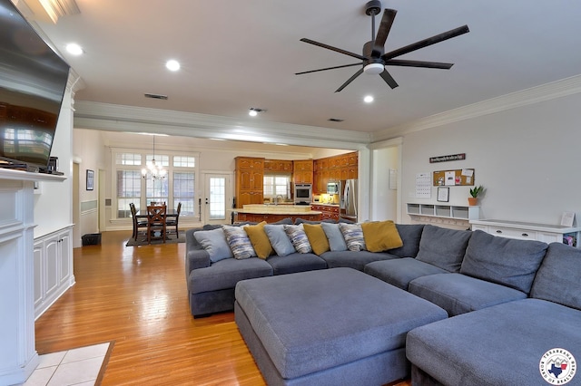 16 Bill Rogers Dr, Texarkana, TX 75503 - living area featuring ornamental molding, a chandelier, a ceiling fan, light wood-style floors, and recessed lighting