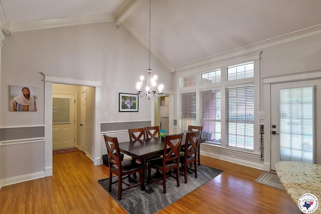 16 Bill Rogers Dr, Texarkana, TX 75503 - dining room featuring crown molding, a chandelier, light wood-style floors, plenty of natural light, and baseboards