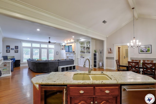 16 Bill Rogers Dr, Texarkana, TX 75503 - kitchen with a sink, beverage cooler, a chandelier, wood finished floors, and ceiling fan