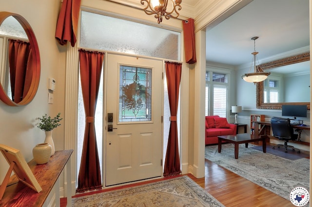 16 Bill Rogers Dr, Texarkana, TX 75503 - entrance foyer with ornamental molding, wood finished floors, and a chandelier