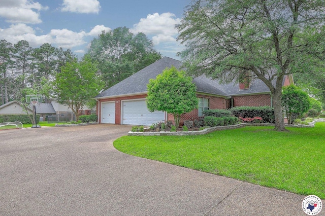 16 Bill Rogers Dr, Texarkana, TX 75503 - view of front facade with asphalt driveway, brick siding, an attached garage, a front yard, and a shingled roof