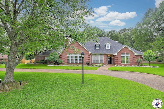 16 Bill Rogers Dr, Texarkana, TX 75503 - view of front of house with brick siding and a front lawn