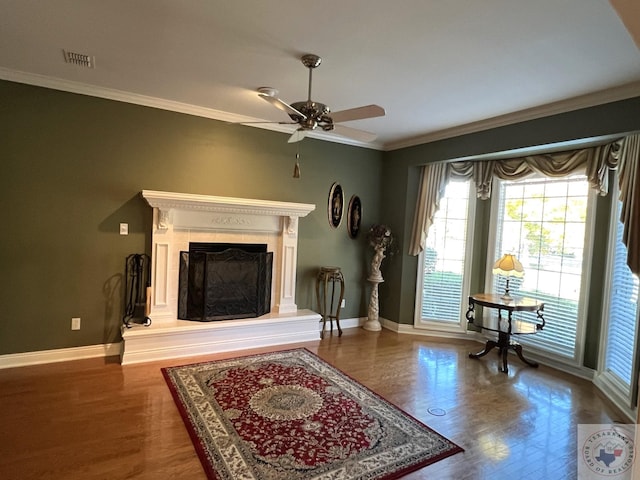 interior space with crown molding, hardwood / wood-style flooring, and ceiling fan