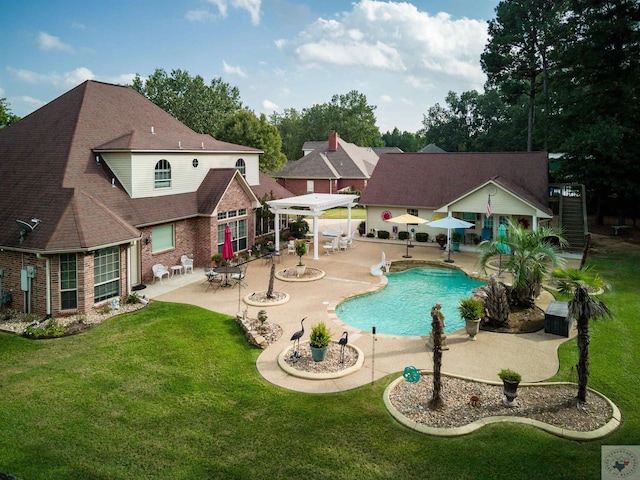 view of pool featuring a patio, a pergola, and a yard