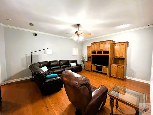 living room featuring ceiling fan, light hardwood / wood-style flooring, and ornamental molding