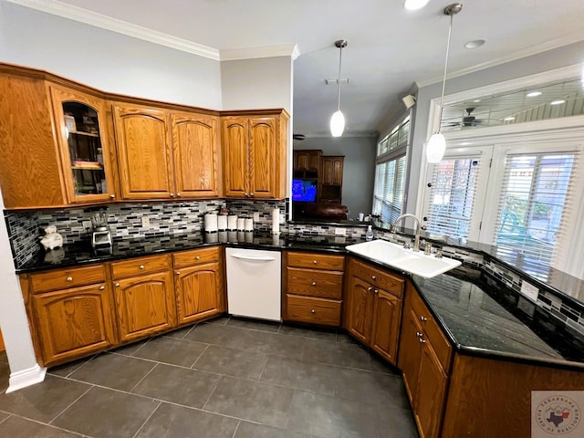 kitchen with sink, pendant lighting, kitchen peninsula, and dishwasher