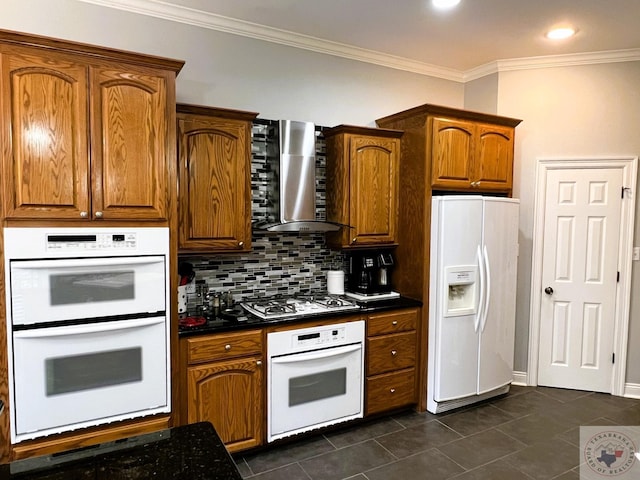 kitchen with white appliances, wall chimney range hood, ornamental molding, and tasteful backsplash