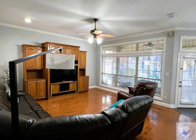 living room with ceiling fan, ornamental molding, and wood-type flooring