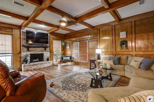 3502 Tiffany Ln, Texarkana, AR 71854 - living area featuring coffered ceiling, beam ceiling, wood finished floors, wooden walls, and a brick fireplace
